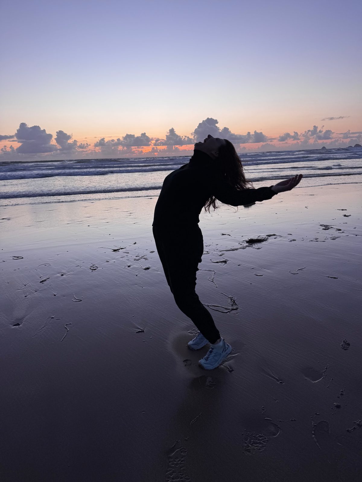 SalliAnne Maliguine on the beach at sunset